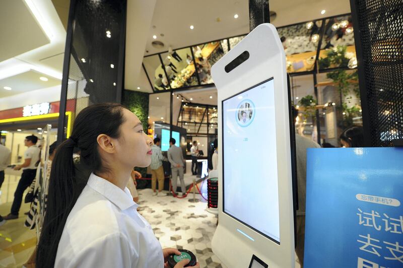 HANGZHOU, CHINA - SEPTEMBER 01:  A customer purchases goods via Alipay which could collect money through recognizing customers' identity at KFC's KPRO restaurant on September 1, 2017 in Hangzhou, Zhejiang Province of China. Alipay uses face recognition system to collect money when customers take commodities to pass through a payment gateway.  (Photo by VCG/VCG via Getty Images)