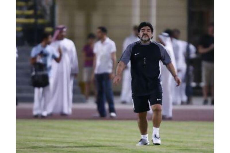 Al Wasl's head coach Diego Maradona appears on the pitch earlier this week. A reader cautions that people should be realistic about Maradona's performance instead of being enamoured by his fame. Mike Young / The National
