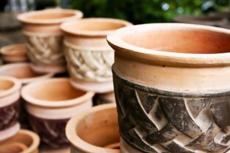Pots made from porous materials such as terracotta allow water to evaporate, which can cool plant's roots in summer. iStockphoto.com