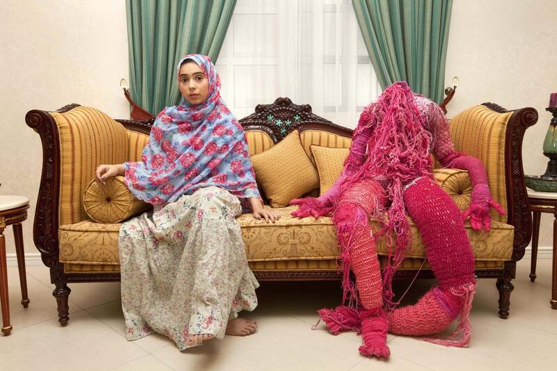 Sara Al Haddad the resident artist at Ductac in Dubai, poses for a portrait with the sculpture Self Portrait (yarn, cotton and pins). Jaime Puebla / The National