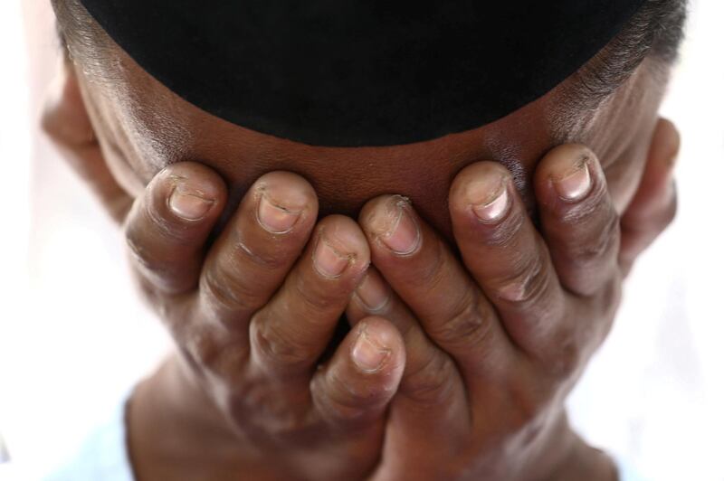 A resident affected by the earthquake and tsunami cries during Friday prayers in Palu. Reuters