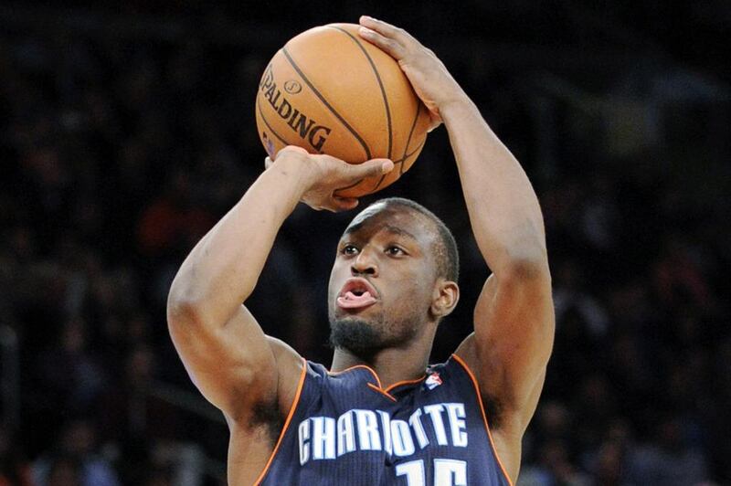 Kemba Walker had 25 points for Charlotte in New York on Tuesday night. Bill Kostroun / AP