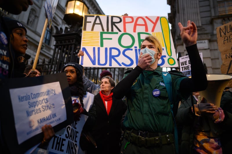 An ambulance paramedic speaks as NHS workers and supporters gather outside Downing Street during strike action in 2022. Getty Images