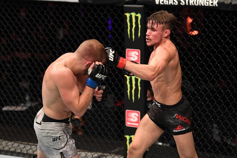 ABU DHABI, UNITED ARAB EMIRATES - OCTOBER 24:  In this handout image provided by UFC, (R-L) Nathaniel Wood of England punches Casey Kenney in their catchweight bout during the UFC 254 event on October 24, 2020 on UFC Fight Island, Abu Dhabi, United Arab Emirates. (Photo by Josh Hedges/Zuffa LLC via Getty Images)