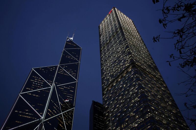 FILE PHOTO: A evening view of Cheung Kong Centre (R) and the Bank of China Tower at Hong Kong's business Central district March 29, 2011.    REUTERS/Bobby Yip/File Photo                           GLOBAL BUSINESS WEEK AHEAD
