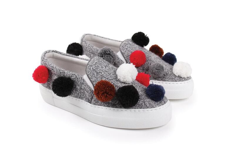 Grey pom-pom slip on shoes  by Joshua Sanders for s*uc boutique. Courtesy s*uce boutique
