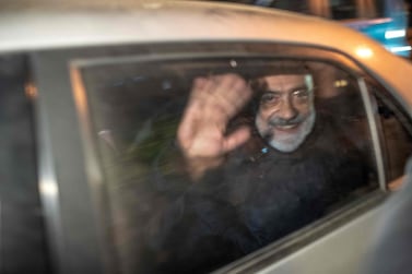 Journalist and writer Ahmet Altan waves in a car as he is detained on November 12, just a week after he was released from prison. AFP. 