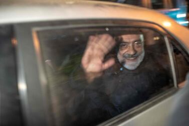 Journalist and writer Ahmet Altan waves in a car as he is detained on November 12, just a week after he was released from prison. AFP. 