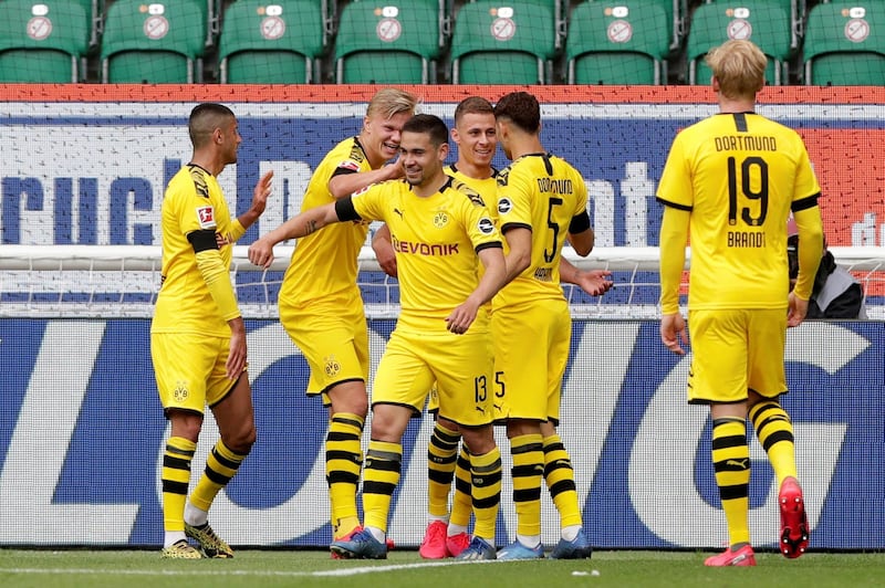 Borussia Dortmund's Raphael Guerreiro celebrates scoring their first goal. Reuters
