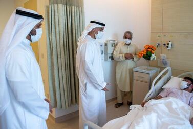 Sheikh Khaled bin Mohamed, member of the Executive Council and chairman of Abu Dhabi Abu Dhabi Executive Office, visits people injured in a gas explosion last month, at Sheikh Shakhbout Medical City on Tuesday. Courtesy: Abu Dhabi Government Media Office