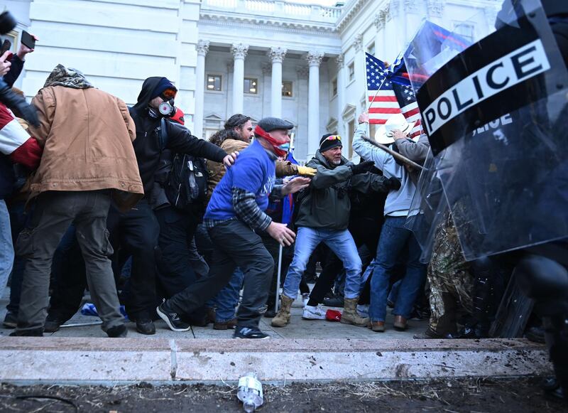 Trump supporters clash with police and security forces, as they storm the US Capitol. AFP