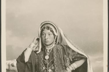 A studio portrait of a woman. The text on the reverse side reads "Ramallah girl". Gail O'Keefe Edson. Courtesy of Akkasah Centre for Photography