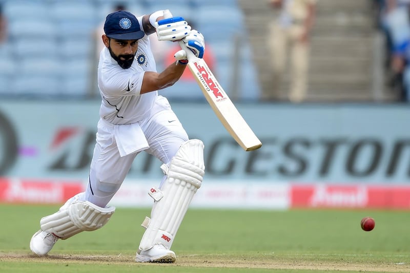 TOPSHOT - India's captain Virat Kohli plays a shot on the second day of the second Test cricket match between India and South Africa at the Maharashtra Cricket Association Stadium in Pune on October 11, 2019. ----IMAGE RESTRICTED TO EDITORIAL USE - STRICTLY NO COMMERCIAL USE-----
 / AFP / PUNIT PARANJPE / ----IMAGE RESTRICTED TO EDITORIAL USE - STRICTLY NO COMMERCIAL USE-----
