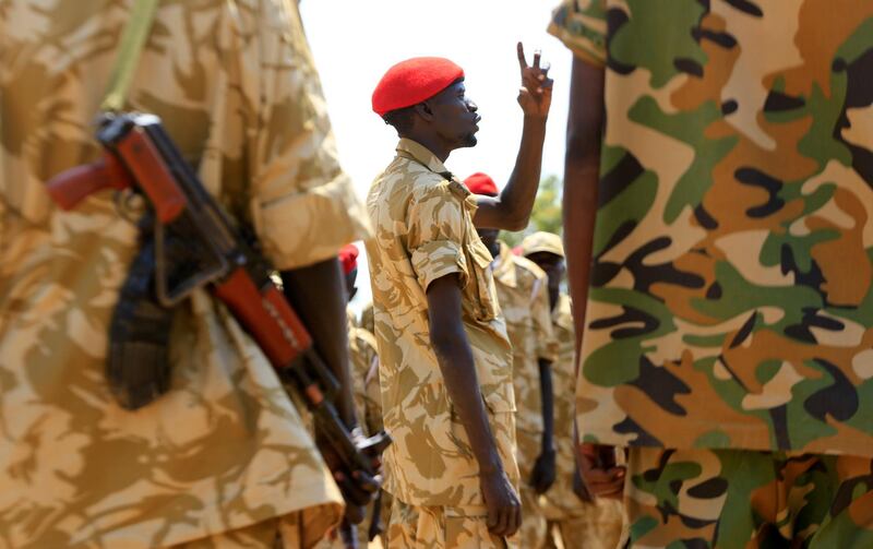 South Sudanese soldiers gather for a briefing at the army general headquarters in Juba, January 8, 2014. REUTERS/James Akena (SOUTH SUDAN - Tags: POLITICS CIVIL UNREST CONFLICT MILITARY)