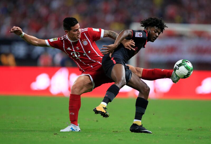 Soccer Football - Bayern Munich vs Arsenal - International Champions Cup - Shanghai, China - July 19, 2017   Bayern Munich's James Rodriguez in action with Arsenal's Ainsley Maitland-Niles   REUTERS/Aly Song