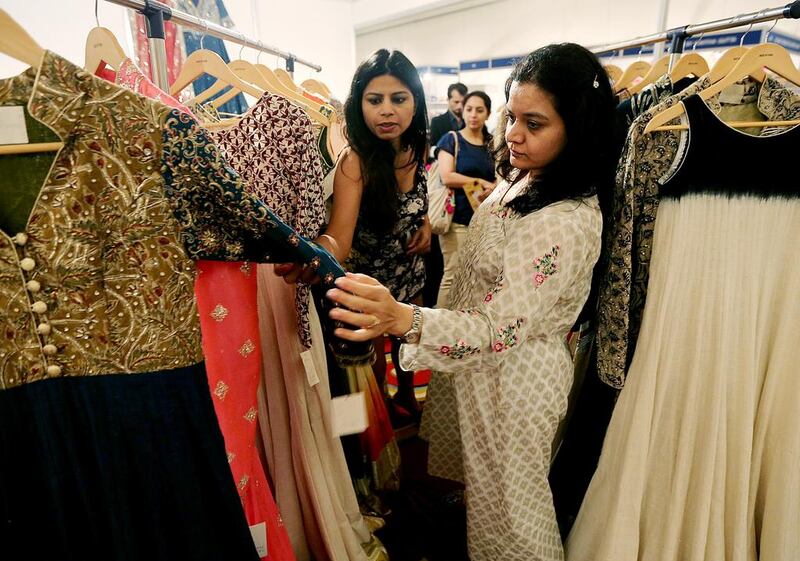 Brides-to-be browse the extravagant dress designs at the Big Fat Indian Wedding Expo in Dubai . Satish Kumar / The National