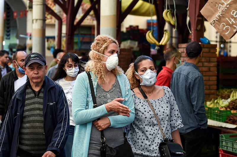 Shoppers wearing face masks due to the COVID-19 coronavirus pandemic browse through the central market in the Tunisian capital Tunis on May 4, 2020, as Tunisian authorities begin a gradual sector and region-based deconfinement process. - This year Ramadan has lost its flavours because of the lockdown due to the coronavirus pandemic.
The mosques have been closed since March in Algeria, Morocco and Tunisia, preventing the collective night prayer.
Absent also are the long musical evenings and large family gatherings. (Photo by FETHI BELAID / AFP)