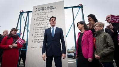 Labour leader Ed Miliband unveils Labour's pledges carved into a stone plinth in Hastings during General Election campaigning.