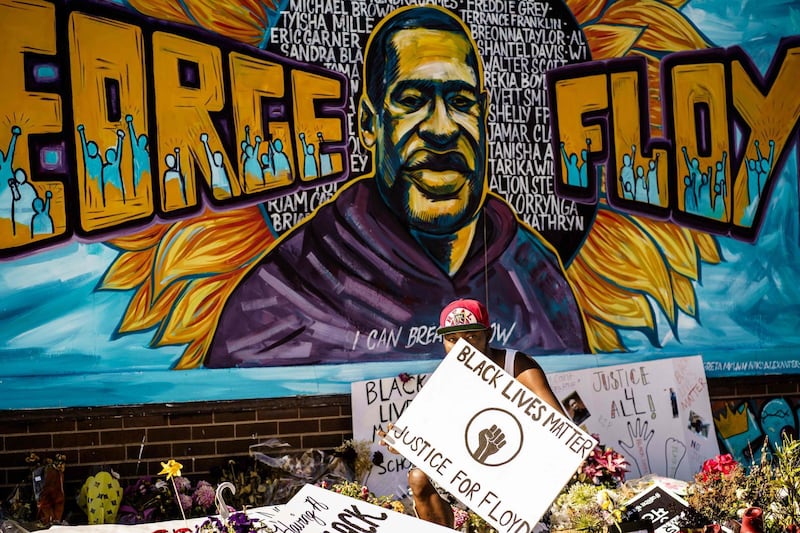 A man reacts at a memorial for George Floyd following a day of demonstration in a call for justice for the black American who died while in custody of the Minneapolis police, on June 5, 2020, in Minneapolis, Minnesota. AFP