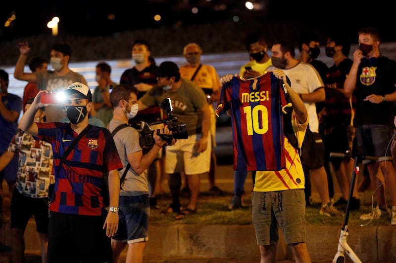 Dozens of FC Barcelona fans gather outside Camp Nou Stadium.  EPA
