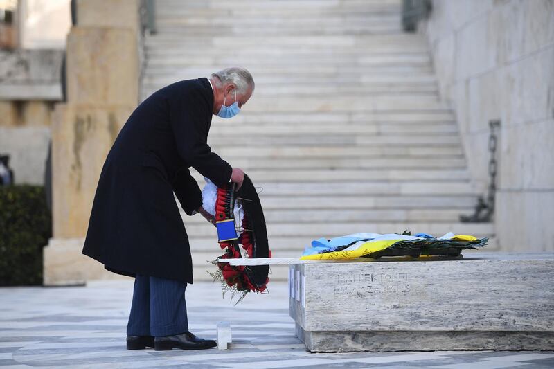Prince Charles lays a wreath at the tomb of the Unknown Soldier in Syntagma Square. Getty Images