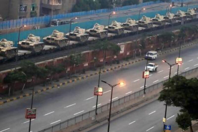 Tanks loaded on a train prepare to enter Cairo, ahead of demonstrations against Egyptian President Mohammed Morsi.