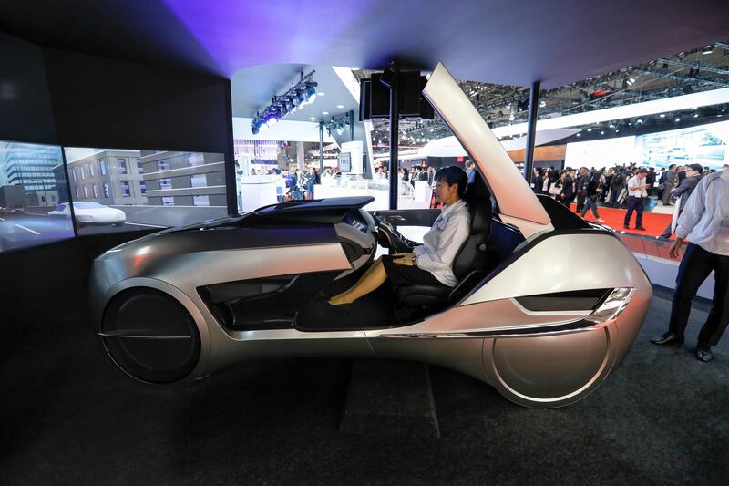 epa06287662 Mitsubishi Electric Corp. staff sits in the driver's seat of its concept vehicle EMIRAI 4 at the 45th Tokyo Motor Show 2017 in Tokyo, Japan, 25 October 2017. The Tokyo Motor Show will be open to the general public from 28 October to 05 November 2017.  EPA/KIMIMASA MAYAMA
