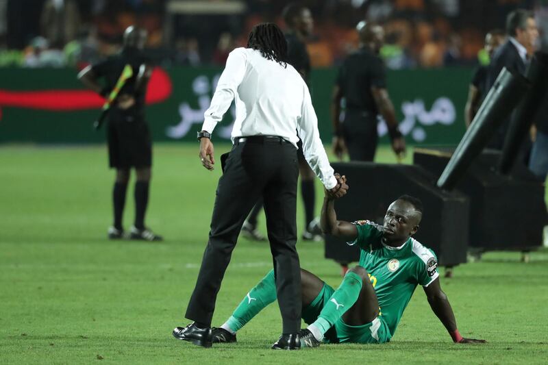 Senegal's manager Aliou Cisse consoles Liverpool's Sadio Mane. AP