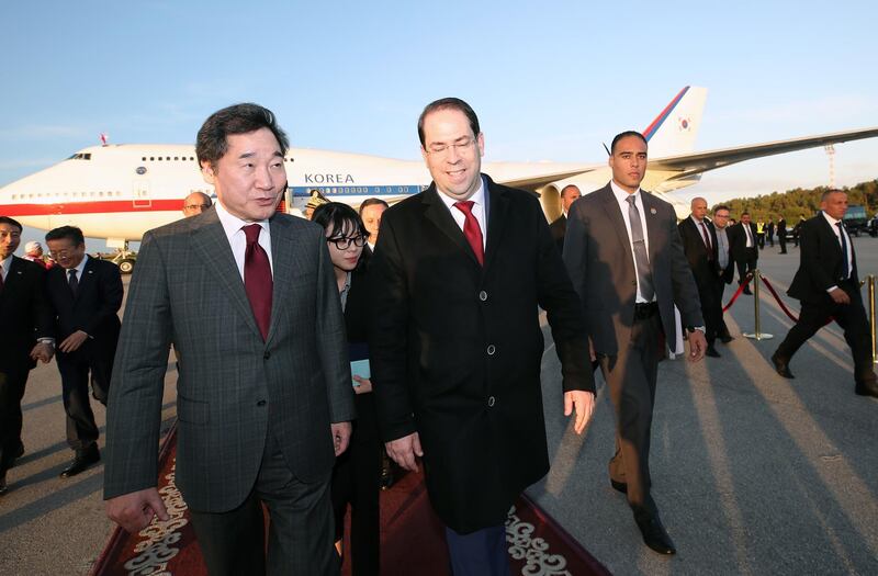 South Korea Prime Minister Lee Nak-yon, left, is greeted by Youssef Chahed, the Head of Government of Tunisia, as he arrives at Carthage International Airport in Tunis. EPA