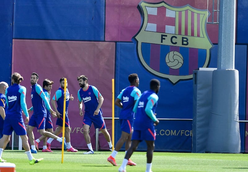 Barcelona players run drills during a training session at the Joan Gamper Sports City. AFP