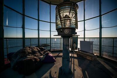 A small screen is placed inside the Pater Noster lighthouse on the island of Hamneskar off Sweden's west coast, on January 30, 2021, north west of Gothenburg. The island will be nurse Lisa Enroth's home for a week after she won a competition by Gothenburg Film Festival to enjoy her own isolated cinema, watching films on her own on the island with little contact with the outside world. The lighthouse was built in 1868 to guide ships into the port of Gothenburg and decommissioned in 1977. / AFP / Jonathan NACKSTRAND / TO GO WITH AFP STORY by Tom LITTLE
