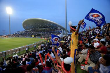 Mumbai Indians fans cheer their team against the Kolkata Knight Riders during the opening Indian Premier League match at Zayed Cricket Stadium in Abu Dhabi on April 14, 2014. Ravindranath K / The National