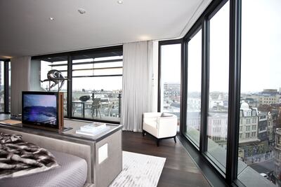 Mandatory Credit: Photo by REX/Shutterstock (1321782u)
A master bedroom of one of the luxury flats in One Hyde Park
Luxury apartment complex One Hyde Park built by Christian and Nick Candy, London, Britain - 05 Apr 2011
One Hyde Park has quickly become one of the most desirable - not to mention expensive - addresses on the planet. On average properties in the luxury London development cost Â£6,000 per square foot, compared to a city-wide average of Â£200 to Â£300. The complex was designed by Millennium Dome architect Lord Rogers and is the brainchild of property tycoon brothers Nick and Christian Candy. In total there are 86 apartments, as well as a private cinema, a 21m swimming pool, saunas, a gym, a golf simulator, a wine cellar and a valet and a concierge. The cheapest one-bedroom flat available is believed to cost around Â£6.75m, while larger one reportedly go for around Â£30m. Even the annual service charge tops Â£100,000 a year. The exclusive address is over the road from Harvey Nichols and just a stone's throw from Kensington Palace. It is also next door to the Mandarin Oriental hotel and a special team of 60 employees is on hand to provide room service to those who live at One Hyde Park.