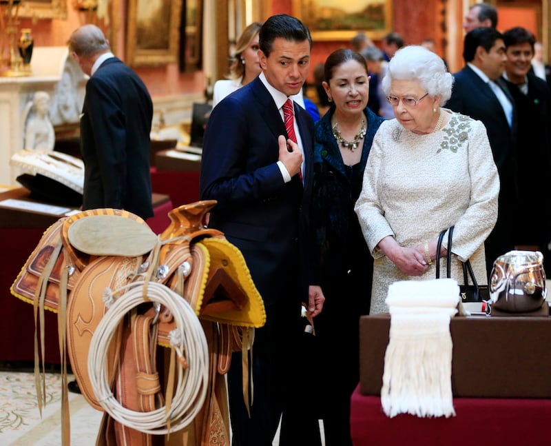 President of Mexico Enrique Pena Nieto is shown Mexican items in the Royal Collection by Queen Elizabeth at Buckingham Palace in March 2015. Getty Images