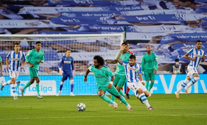Real Madrid's Marcelo on the ball as Real Sociedad's Portu tries to track him down. Reuters
