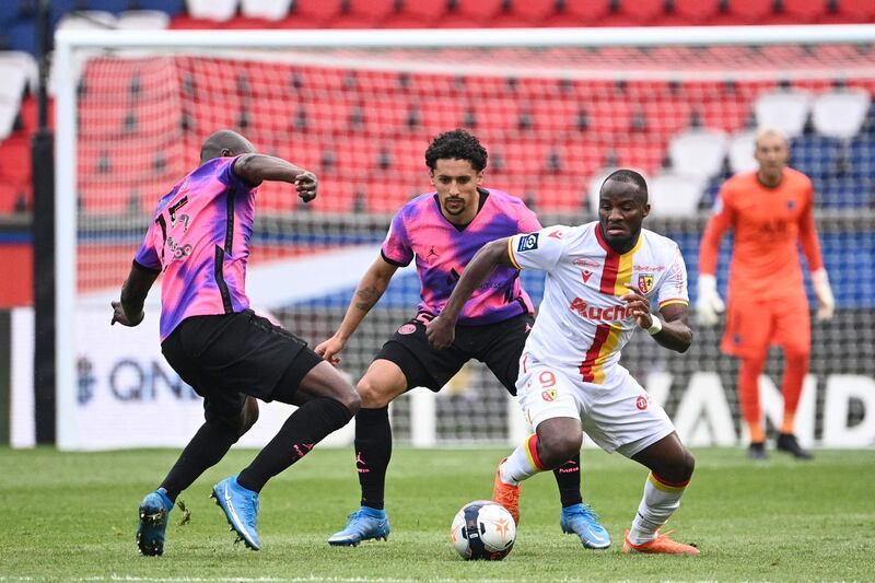 Lens goalscorer Knepe Ganago on the attack in Paris. AFP