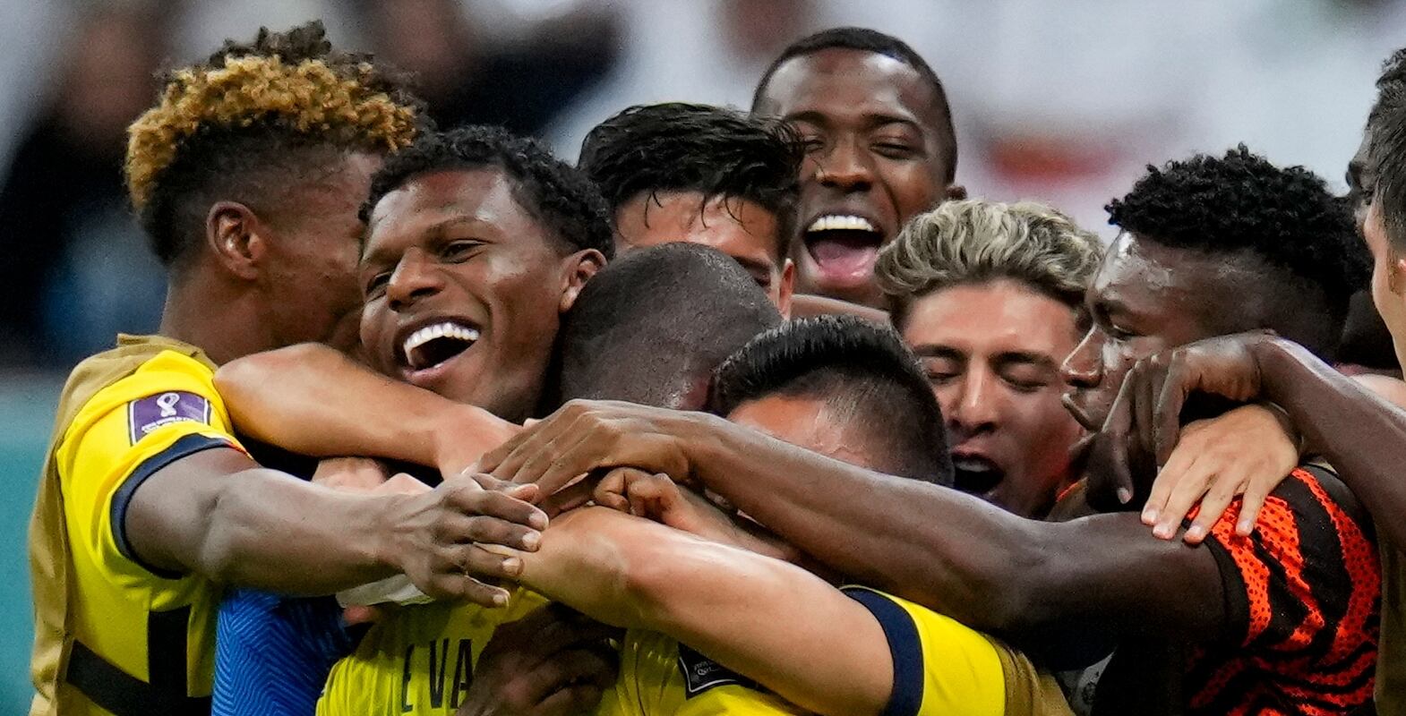 Teammates embrace Ecuador's Enner Valencia after he scored his side's second goal against Qatar during a World Cup group A soccer match at the Al Bayt Stadium in Al Khor , Qatar, Sunday, Nov.  20, 2022.  (AP Photo / Manu Fernandez)