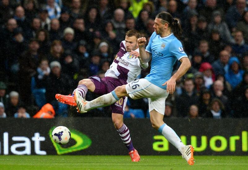 Aston Villa striker Andreas Weimann vies for the ball with Manchester City defender Martin Demichelis during Wednesday's Premier League contest. Andrew Yates / AFP / May 7, 2014