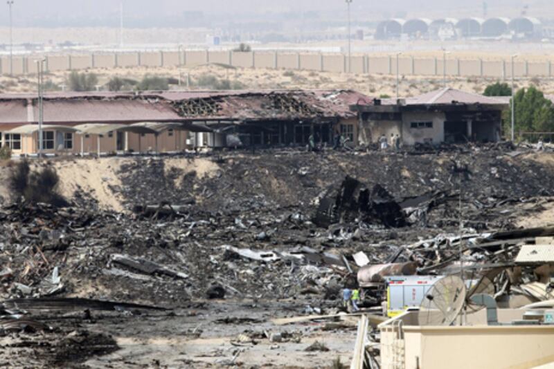 epa02315968 A general view of the site where a cargo airplane crashed while taking off from Dubai airport, United Arab Emirates, on 04 September 2010. A United Parcel Services (UPS) cargo plane crashed near Dubai airport on 03 September 2010 as it was taking off for Germany. Officials in the Emirate said two people died in the incident.  EPA/ALI HAIDER