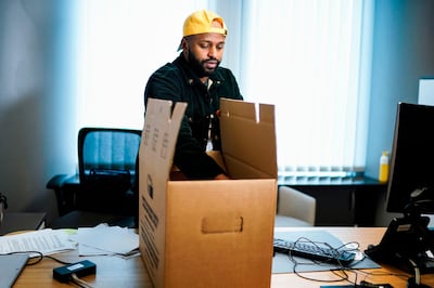 Britain's MEP of the Green party Magid Magid packs his belongings in his office at the European Parliament in Brussels on January 23, 2020.   / AFP / Kenzo TRIBOUILLARD
