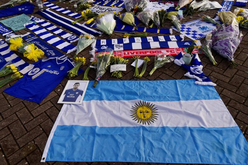 Tributes are left outside the stadium. Reuters