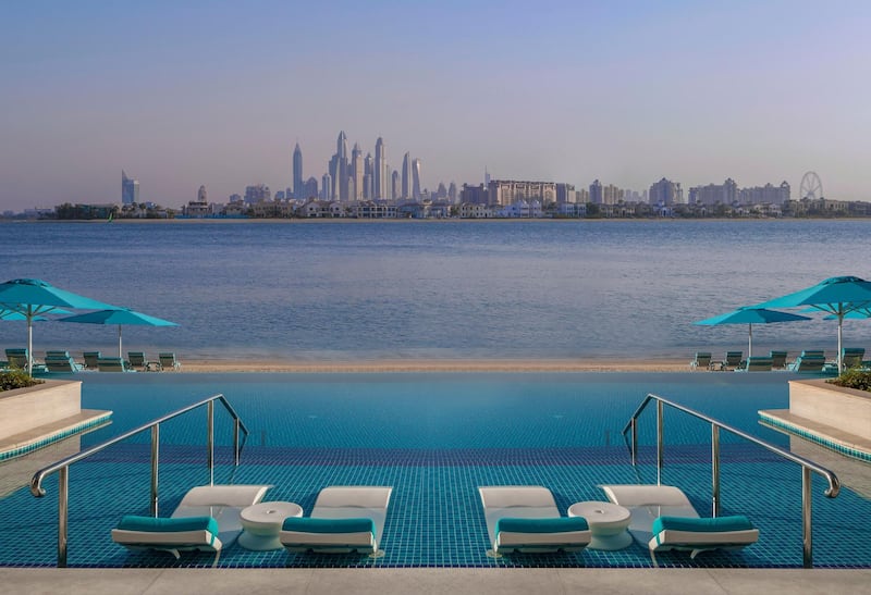 <p>The swimming pool and beach offer views of Dubai&#39;s city skyline. Courtesy The Retreat Palm Dubai MGallery by Sofitel&nbsp;</p>
