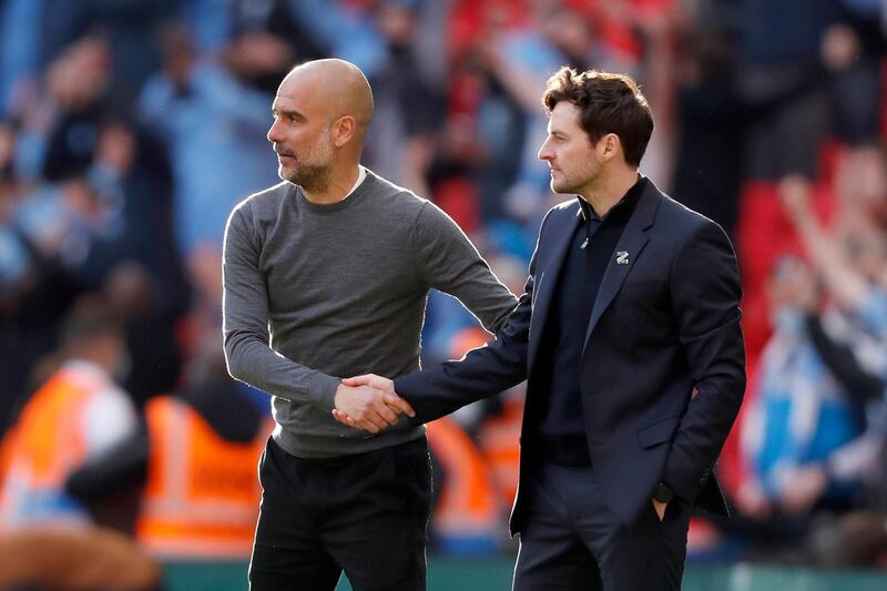 Manchester City's manager Pep Guardiola and Tottenham's caretaker manager Ryan Mason. AP
