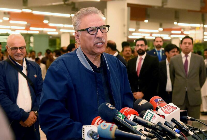 In this picture released by Press Information Department, Pakistan's President Arif Alvi talks to journalists prior to departing to Turkey on a three-day visit, in Islamabad, Pakistan, Sunday, Oct. 28, 2018. Alvi says the country is not going to establish any ties with Israel and that it supports Palestine because Gaza has also faced 'unprecedented atrocities' like Kashmir. (Press Information Department via AP)