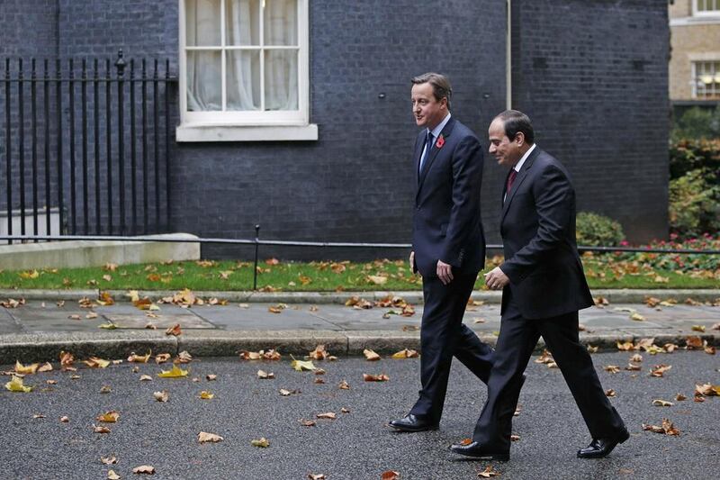 British prime minister David Cameron, left, with Egyptian president Abdel Fattah El Sisi in Downing Street on Thursday. Adrian Dennis / AFP