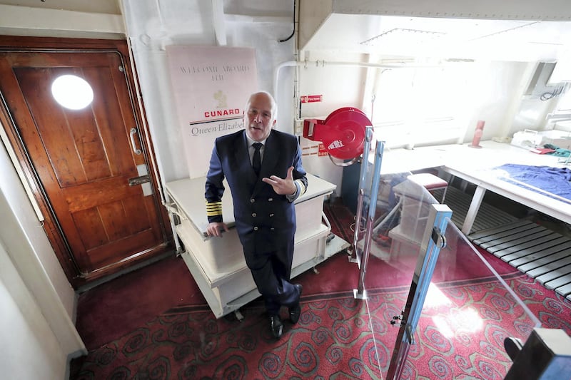 DUBAI, UNITED ARAB EMIRATES , Feb 20  – 2020 :- Peter Warwick , Head of Tour explaining about the Flag room during the Bridge tour at the QE 2 in Dubai. (Pawan  Singh / The National) For Lifestyle. Story by Janice Rodrigues