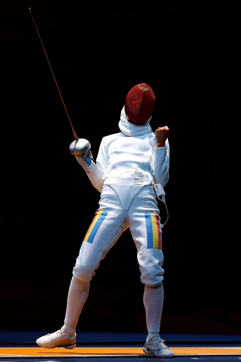 LONDON, ENGLAND - JULY 30:  Simona Gherman of Romania celebrates after a point against Laura Flessel-Colovic of France during the Women's Epee Individual Fencing round of 16 on Day 3 of the London 2012 Olympic Games at ExCeL on July 30, 2012 in London, England.  (Photo by Hannah Johnston/Getty Images)