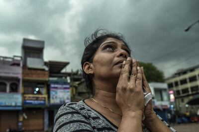 COLOMBO, SRI LANKA - APRIL 23:  Sri Lankan local people pray near to St Anthony Church on April 23, 2019 evening in Colombo, Sri Lanka. At least 321 people were killed with hundreds more injured after coordinated attack on churches and hotels on Easter Sunday rocked three churches and three luxury hotels in and around Colombo as well as at Batticaloa in Sri Lanka. Based on reports, the Islamic State group claimed responsibility for the attacks while investigations have shown that the attack was carried out in retaliation for Christchurch mosque shootings last month. Police have detained 40 suspects so far in connection with the suicide bombs, which injured at least 500 people as the blasts took place at churches in Colombo city as well as neighboring towns and hotels, including the Shangri-La, Kingsbury and Cinnamon Grand. (Photo by Atul Loke/Getty Images)