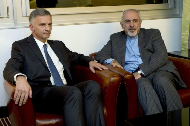 Switzerland's Foreign Minister Didier Burkhalter, left, speaks with Iranian Foreign Minister Mohammad-Javad Zarif, right, during a meeting at the Intercontinental Hotel during to talks about Iran's nuclear programme in Geneva, Switzerland.AP Photo / Keystone, Martial Trezzini