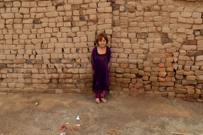 An Afghan girl in Peshawar. The UNHCR says an increasing number of refugees live in urban settings outside refugee camps. EPA